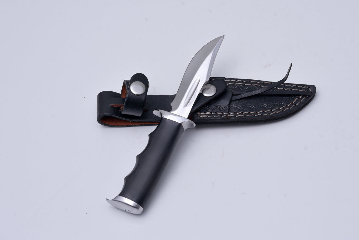 Shadow Fang – Hunting Knife with mirror-polished drop point blade and black micarta handle resting on a natural wood surface