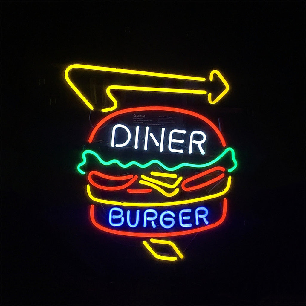 Neon sign of a burger with 'DINER' in white and 'BURGER' in blue inside it, accompanied by a yellow right arrow above against a black background.