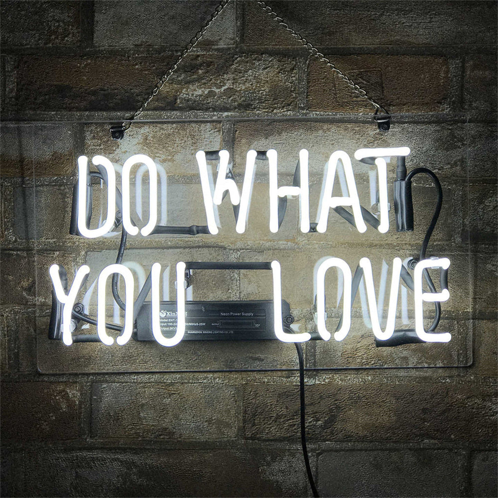 Do What You Love Neon Sign with glowing pink script on a light background