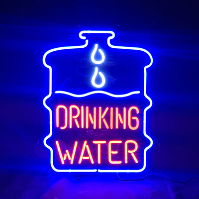 Drinking Water Neon Signs Light glowing in indoor setting with metal grid backing