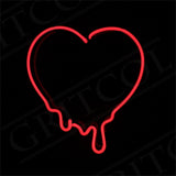 Red neon light shaped like a heart with drips extending downward against a black background.