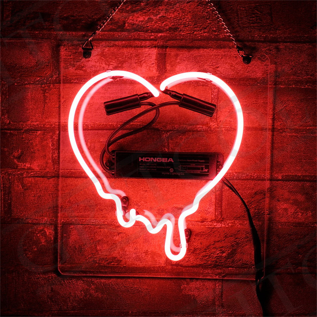 Dripping Heart Neon Sign emitting pink light against a dark background