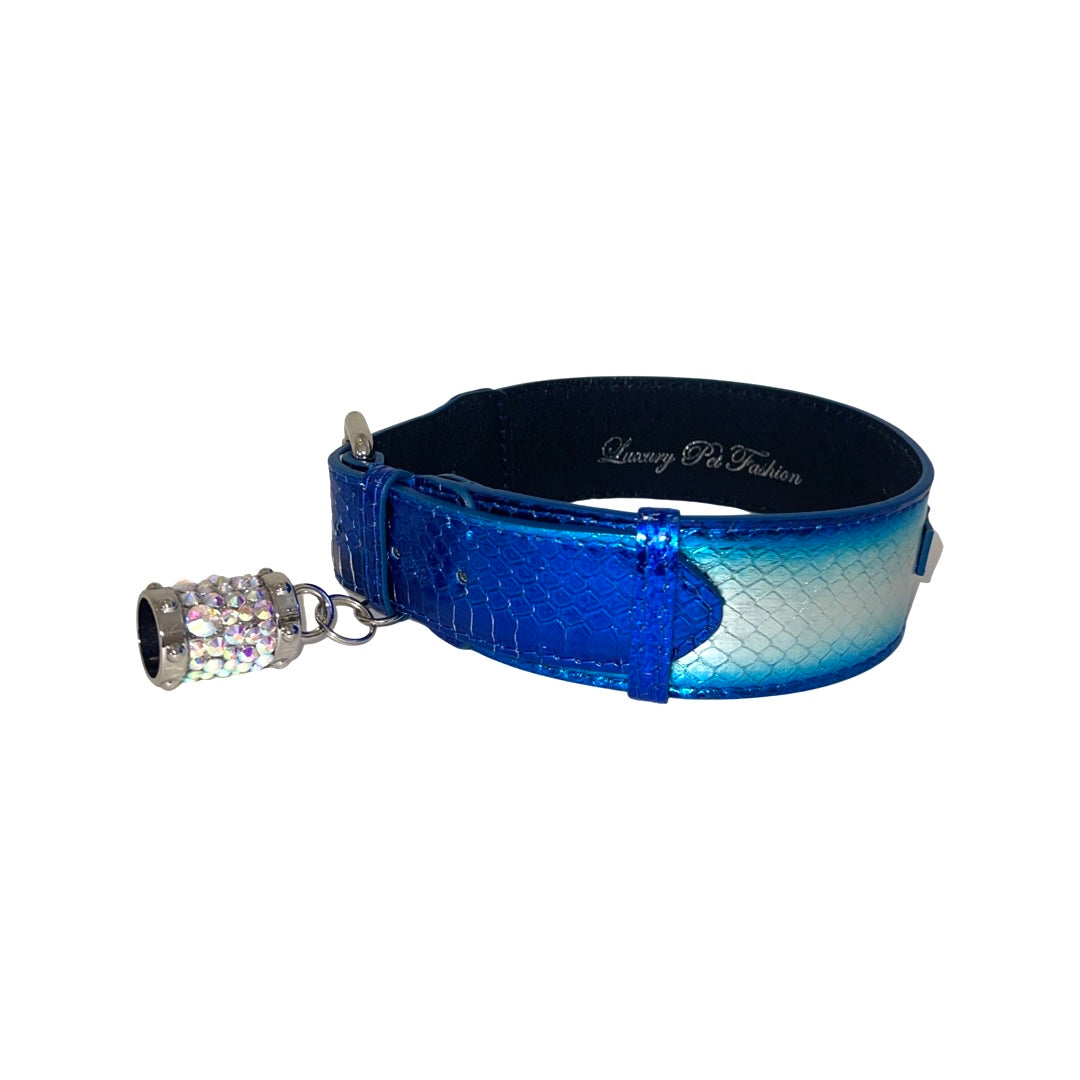 Shiny blue to silver gradient pet collar with a snake scale texture and a small rhinestone-studded bell attached to the front
