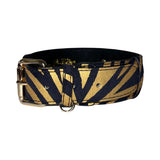 Black and gold zebra-print Italian leather dog collar with gold metal buckle and D-ring, shown against white background