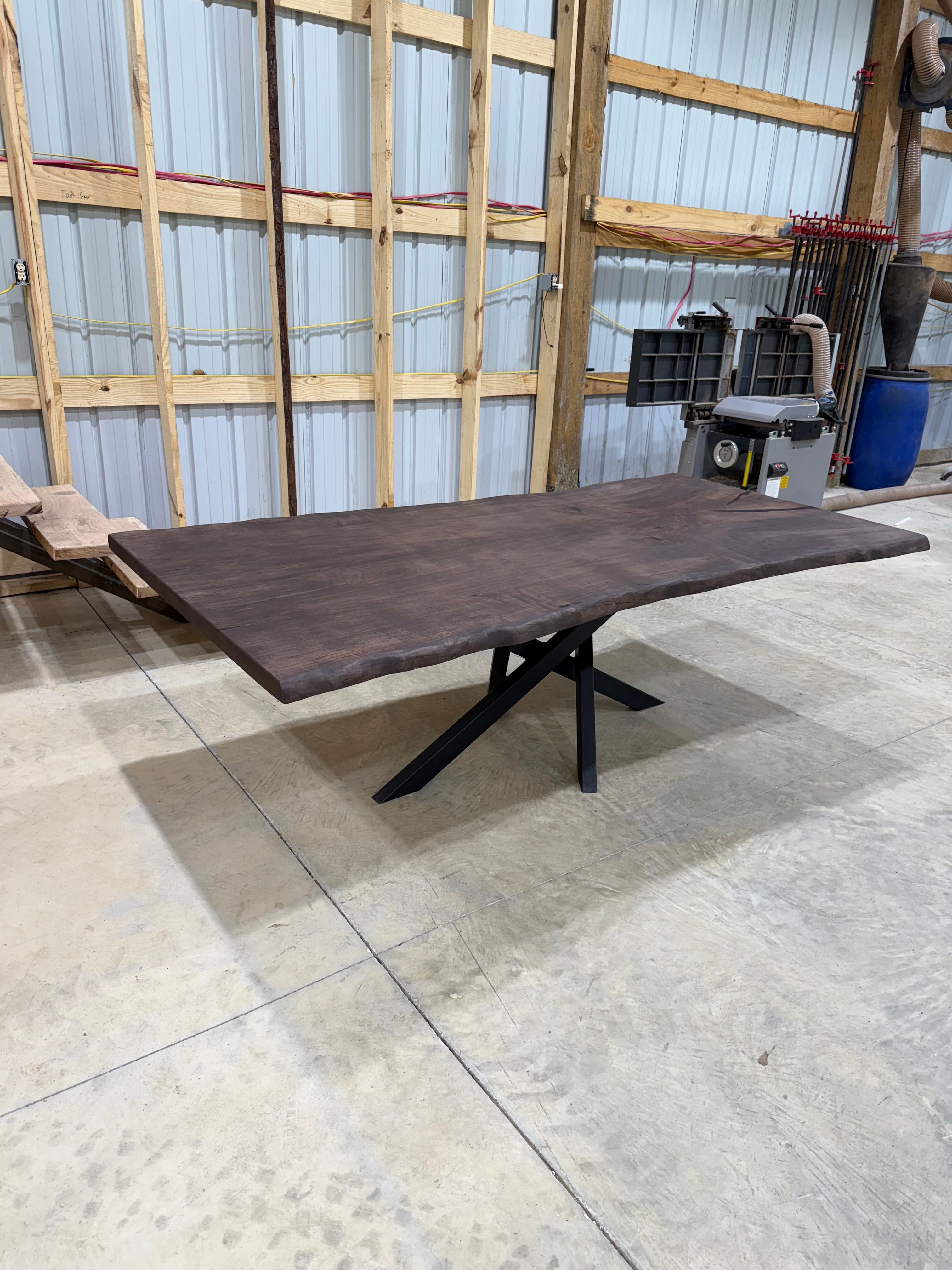 8x~4 Maple Slab Table with chocolate stain and spyder base by Sasquatch Tables LLC