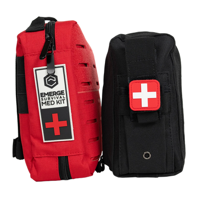 Emerge Survival Emergency Med Kit opened showing various medical supplies inside organized in compartments.