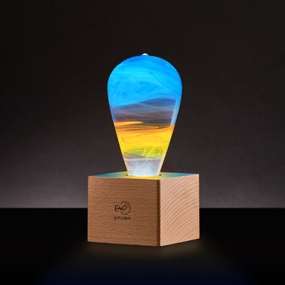 EP Light Fire Decorative Resin LED Bulb with glowing fire effect inside, shown with wooden base options