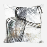Square pillow with abstract design featuring black swirling lines and gray textured shapes on a white background with subtle brown accents