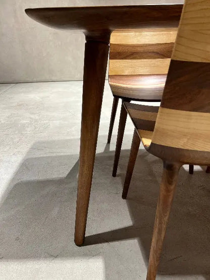 Edge glued solid hardwood dining table with natural wood grain and smooth surface