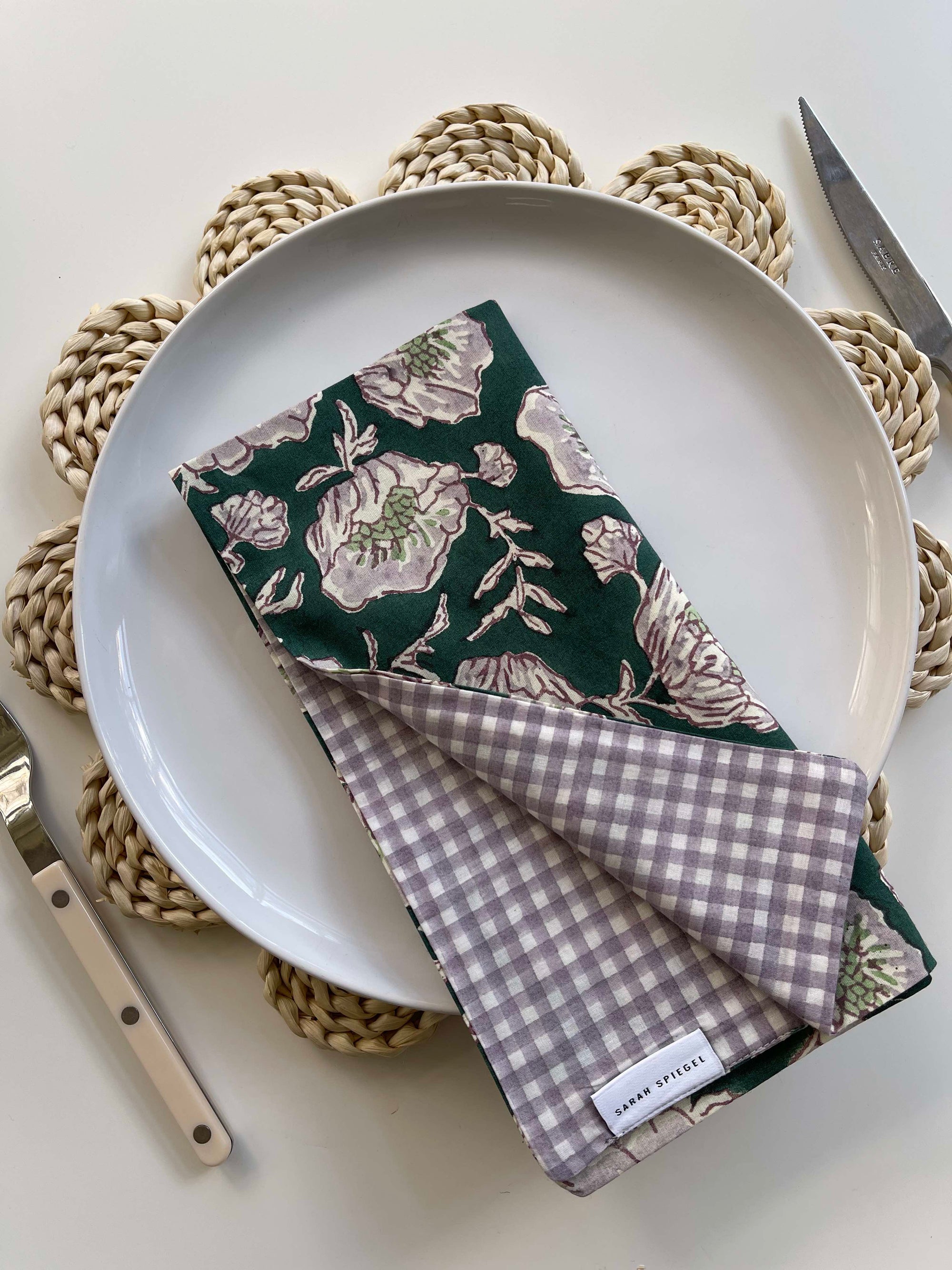 Reversible Floral Napkins folded and displayed showing floral and gingham sides