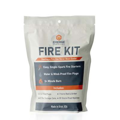 Emerge Survival Fire Kit showing its contents with a mylar bag and ignition tools