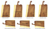 Seven wooden cutting boards with handles, each highlighting different text-placed locations and text alignments on the wood surface in varying positions and justifications.