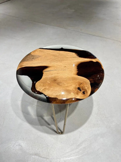 Round walnut wood side table with clear epoxy resin top and rounded edges from Osso Collection