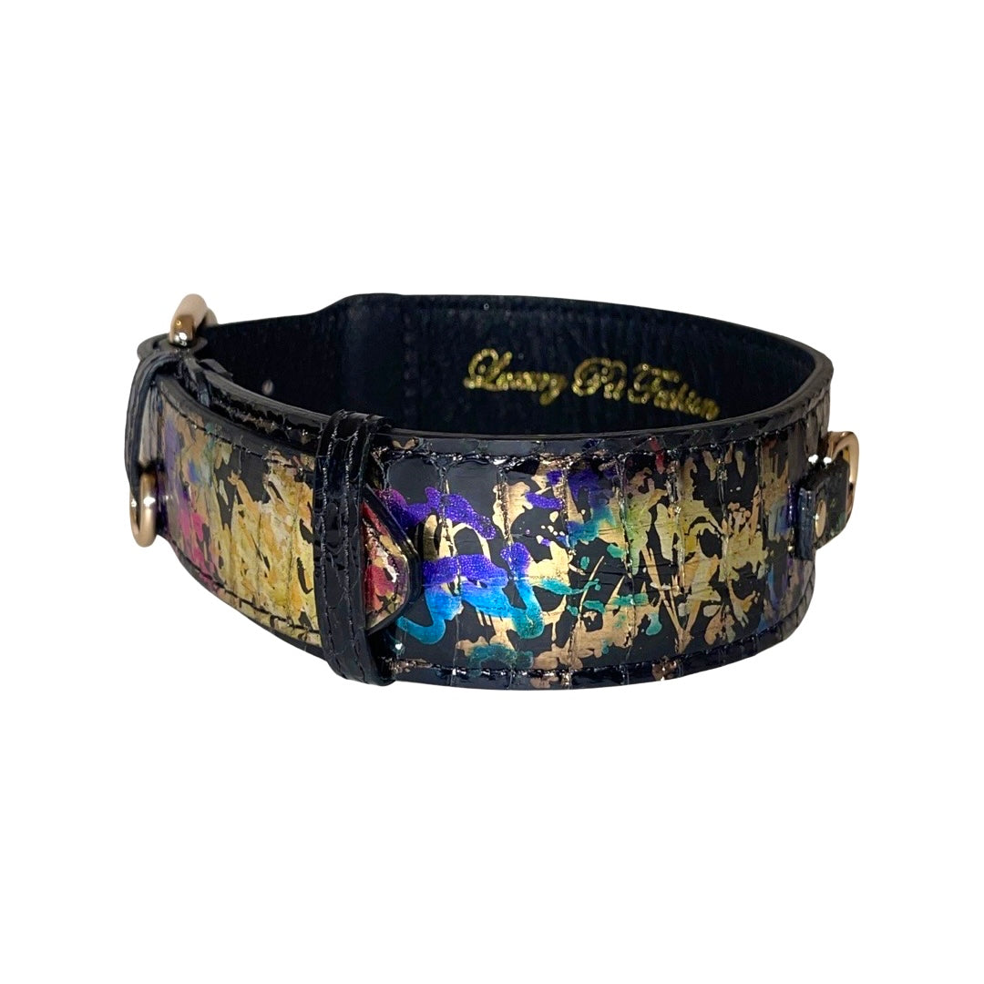 Art Deco style wide black collar with iridescent snake pattern featuring gold, blue, and purple accents and gold-toned hardware, shown on white background.