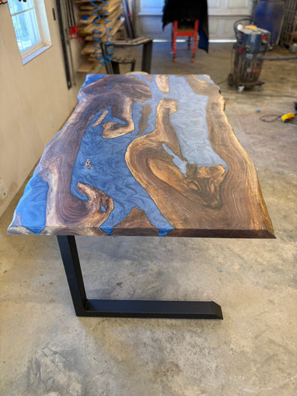 6x3 walnut river table with blue resin inlay in a workshop setting