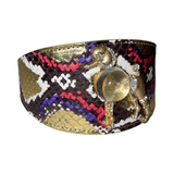Poodle collar with dark snake-patterned base featuring gold, red, purple, and white accents, adorned with a gold poodle charm holding a translucent spherical gemstone.