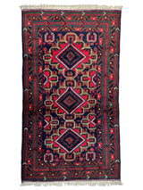 Hand-knotted Afghani Baluch wool rug with geometric patterns in earthy tones