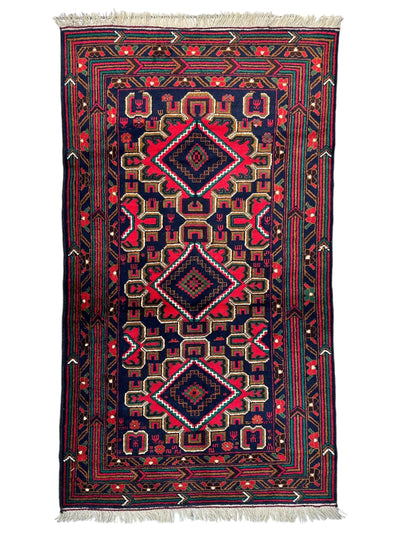 Hand-knotted Afghani Baluch wool rug with geometric patterns in earthy tones