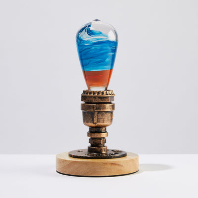 EP Light Fire Decorative Resin LED Bulb with glowing fire effect inside, shown with wooden base options