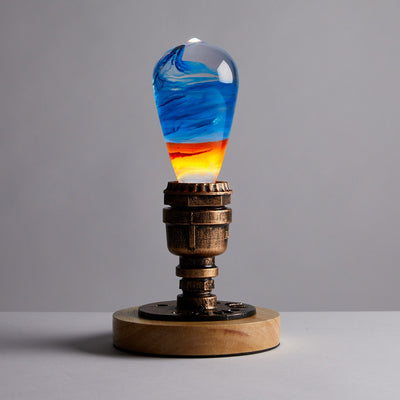 EP Light Fire Decorative Resin LED Bulb with glowing fire effect inside, shown with wooden base options