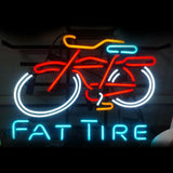 Neon sign of a fat tire bicycle with a red frame, orange seat and handlebars, blue accents, and white tires, with 'FAT TIRE' in blue neon letters below.