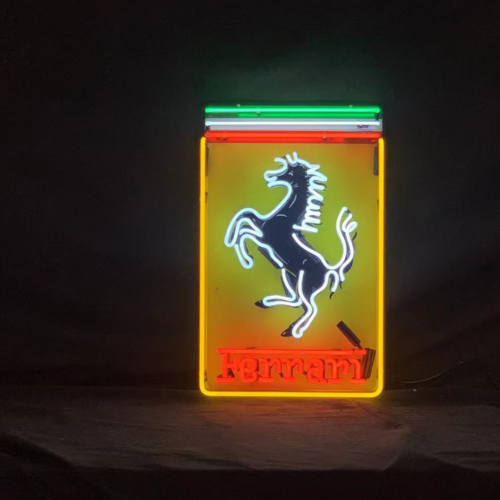 Ferrari Logo Neon Sign glowing red on an acrylic backing with metal grid, displayed indoors