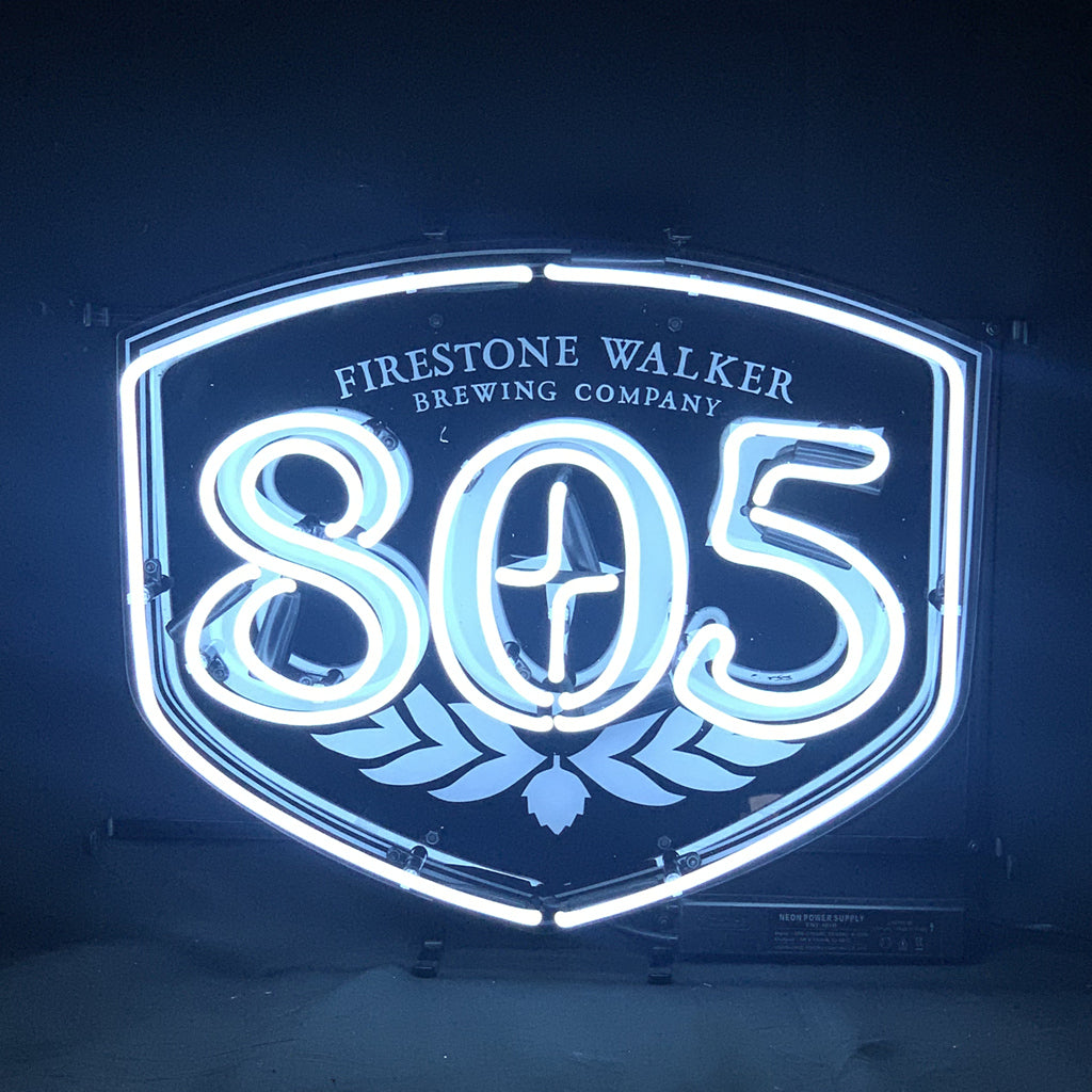 Firestone Walker 805 Brewing Company Neon Sign Light displayed on a wall, showing bright glass tubing and metal grid backing