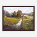 Landscape painting of a winding creek flowing through green fields with yellow wildflowers under a cloudy sky, framed in dark brown wood.