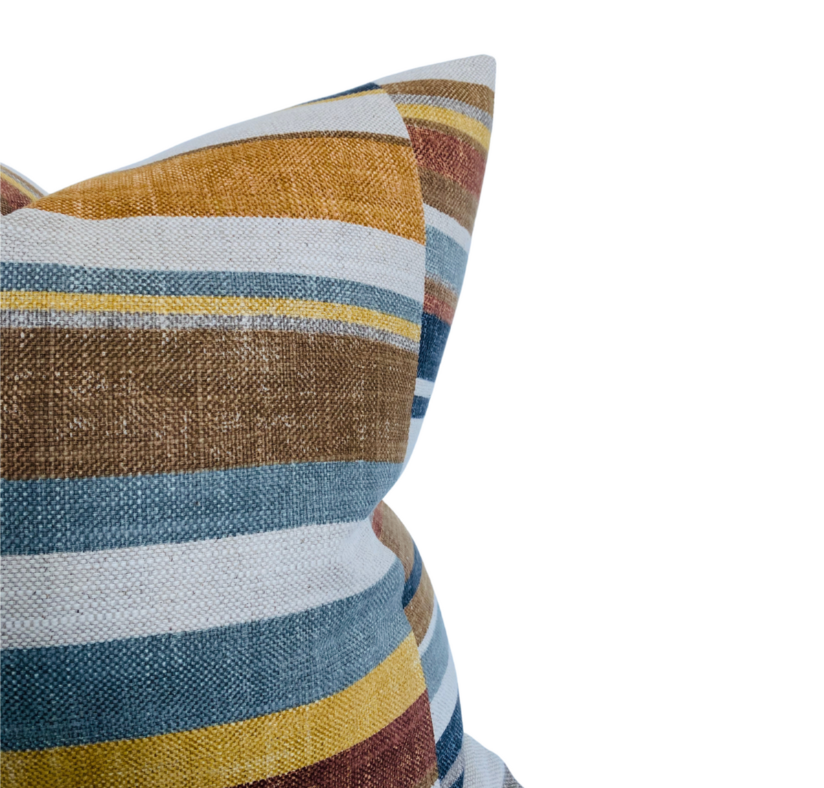 Corner of a pillow cover with horizontal stripes in rust, blue, mustard yellow, white, and brown, featuring a textured woven fabric and block print style.