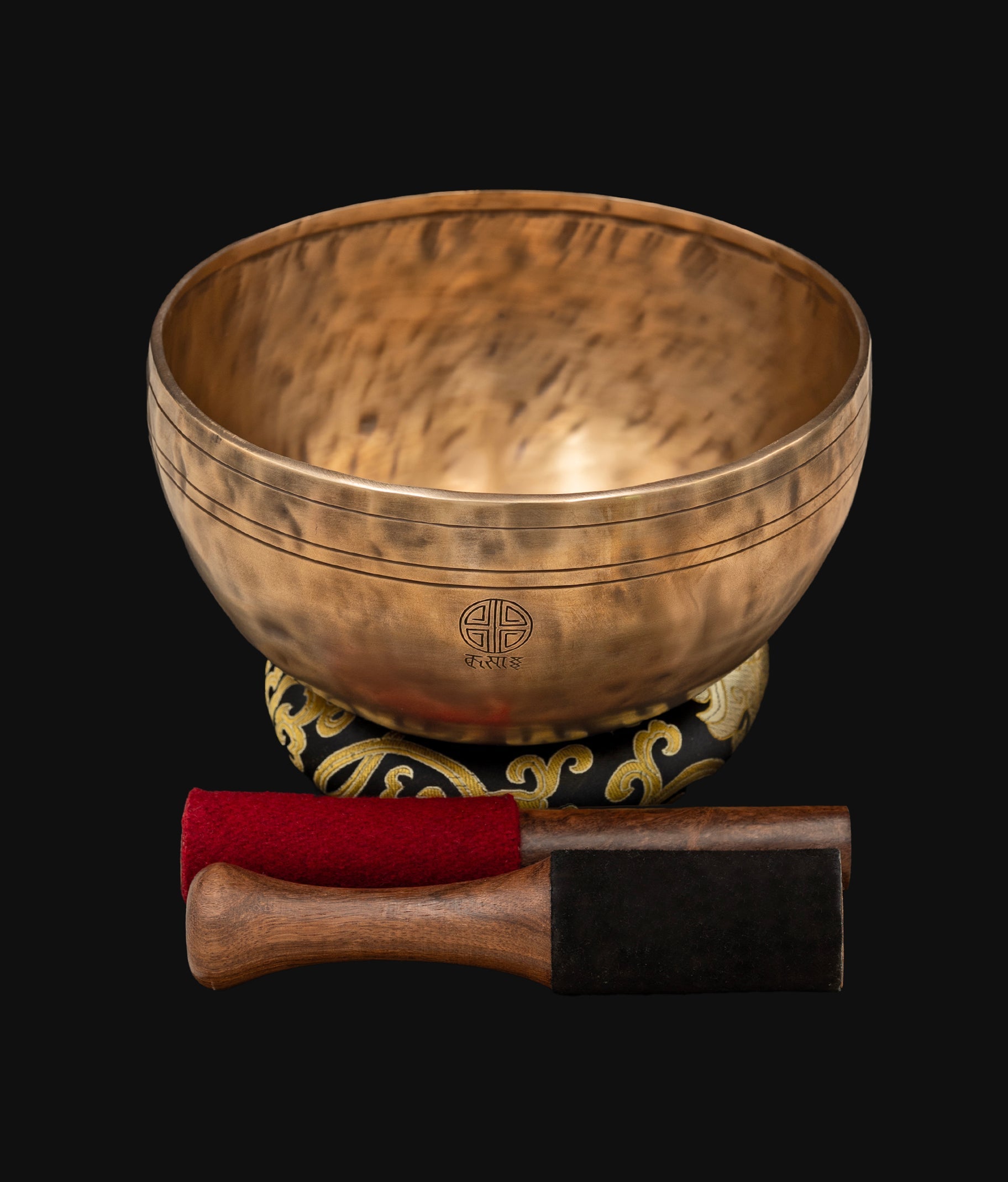 Bodhisattva Full Moon bronze singing bowl with Tibetan inscriptions displayed with professional mallets and cushion