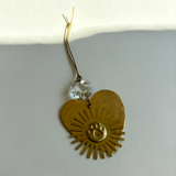 Fur-ever and Always Ornament featuring hammered brass and vintage glass crystal hanging on cord