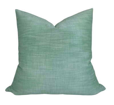 Green woven Maroma Pillow Cover with ivory backing visible