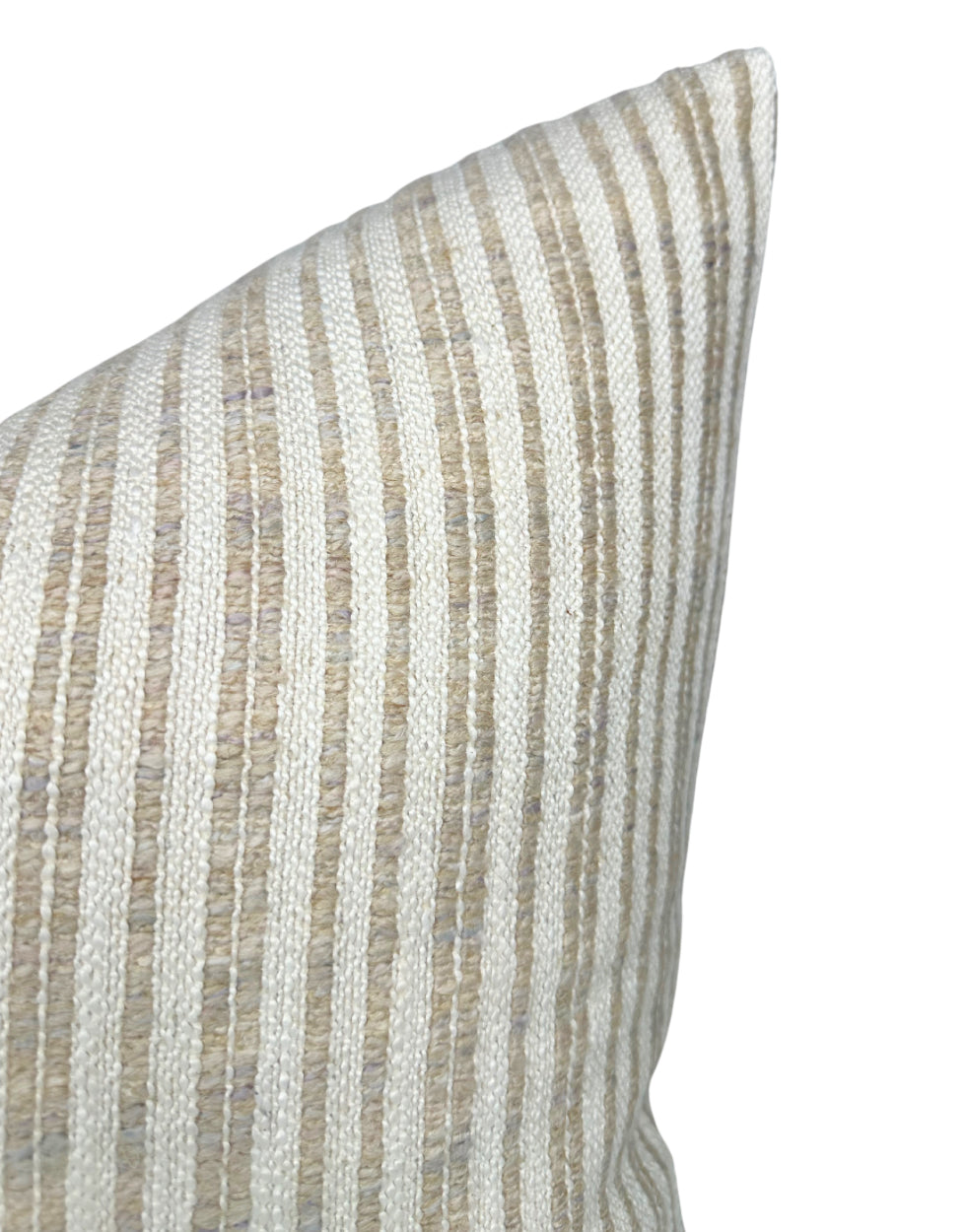 Close-up of a pillow cover with narrow vertical stripes in beige and off-white woven fabric, showing a textured pattern and a pointed corner.