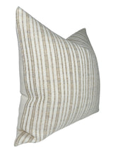Square pillow cover with vertical beige and off-white stripes in a textured fabric, shown at an angle on a white background.