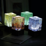 Handcrafted resin table lamp with ocean-inspired colors and warm white LED light