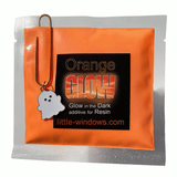 Orange glowing resin projects and glow-in-the-dark pigment pouch with a ghostie clip