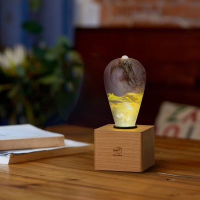 EP Light Golden Resin LED Bulb handcrafted with eco-friendly resin and wooden base options