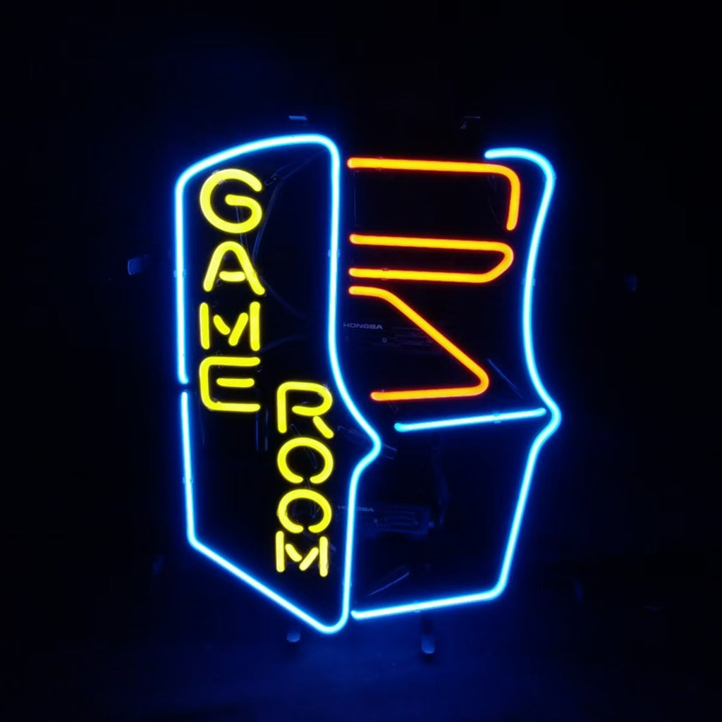 Neon sign shaped like an arcade game machine outlined in blue and orange with the words 'GAME ROOM' in vertical yellow letters on the cabinet sides against a black background.