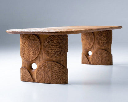 Hand-carved solid oak dining table with geometric patterns and custom-designed legs