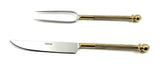 Stainless steel carving knife and fork with gold-toned, textured handles ending in rounded knobs, displayed on a white background, the knife marked Vibsha.