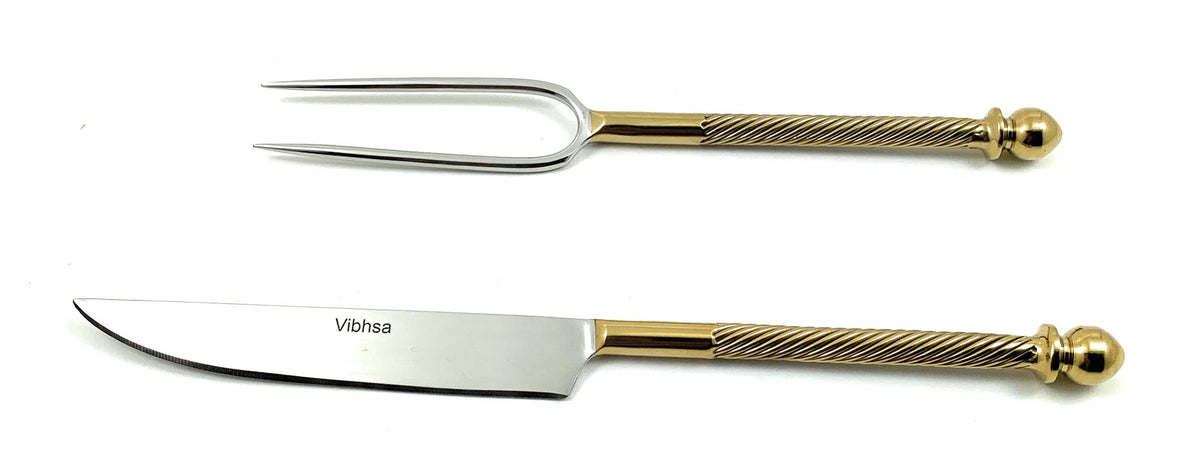 Stainless steel carving knife and fork with gold-toned, textured handles ending in rounded knobs, displayed on a white background, the knife marked Vibsha.
