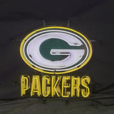 Green Bay Packers neon sign featuring a yellow-outlined white letter G on a green oval background above yellow neon letters spelling PACKERS on a dark wall.