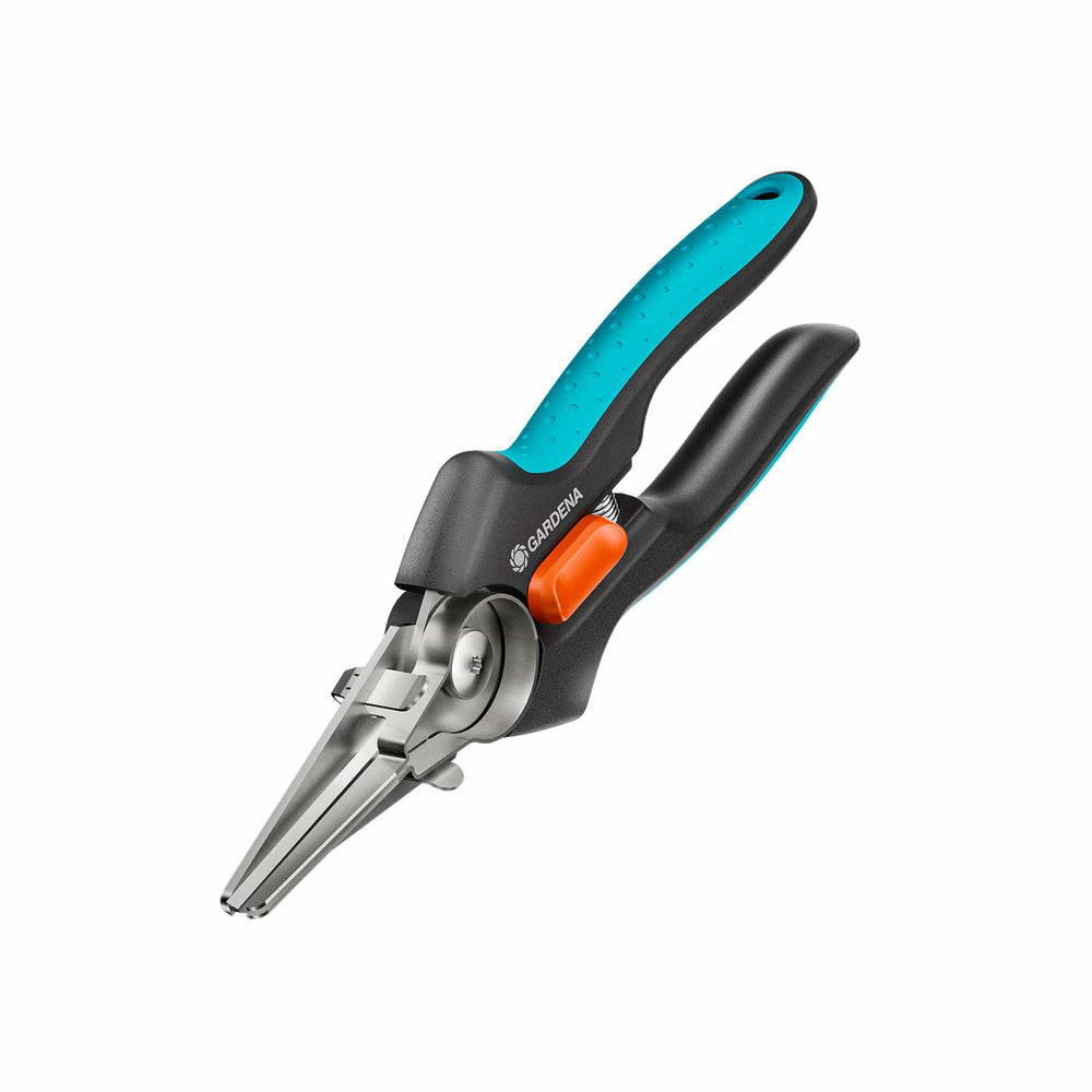 Gardena GripCut garden tool with pointed metal tip, black handles, and a turquoise grip accented with an orange locking button.
