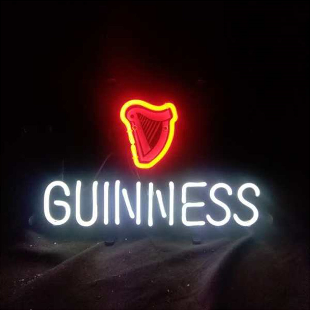 Neon sign with a glowing red harp symbol above white glowing text spelling GUINNESS against a black background.