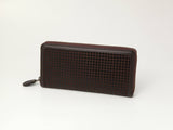 Dark brown long wallet with a zip closure, featuring a textured square pattern on the front and smooth edges, shown on a white background.