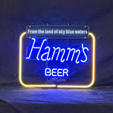 Hamm's Beer From the Land of Sky Blue Waters neon sign lit against a dark background