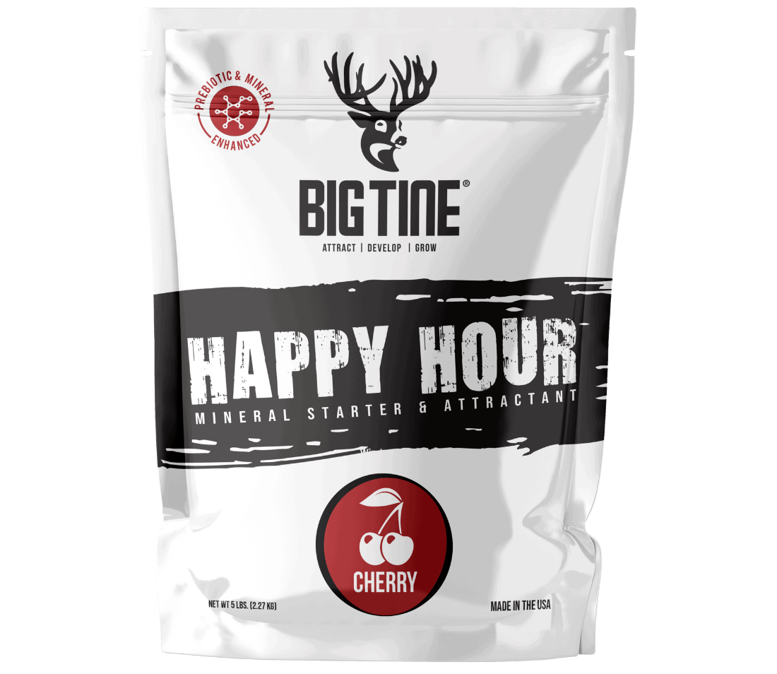 White resealable bag of Big Tine Happy Hour Cherry mineral starter and attractant, featuring a black horizontal stripe and a red cherry icon below the logo.