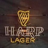 Neon sign with a yellow harp shape above white letters spelling H-A-R-P and yellow letters spelling L-A-G-E-R against a dark background.