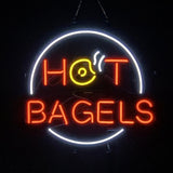 Neon sign with white circular border and glowing red letters spelling 'HOT BAGELS', featuring a yellow bagel with steam lines replacing the letter 'O' in 'HOT'