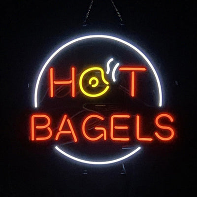 Hot Bagels Neon Signs Light glowing against a dark backdrop with its glass tube and metal chain hanger visible
